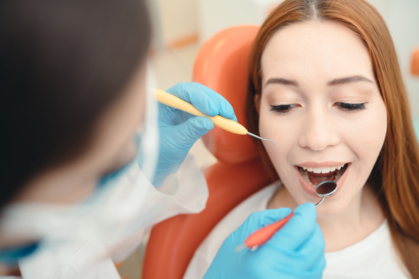 When Should You Choose A Dental Bridge Over An Implant?